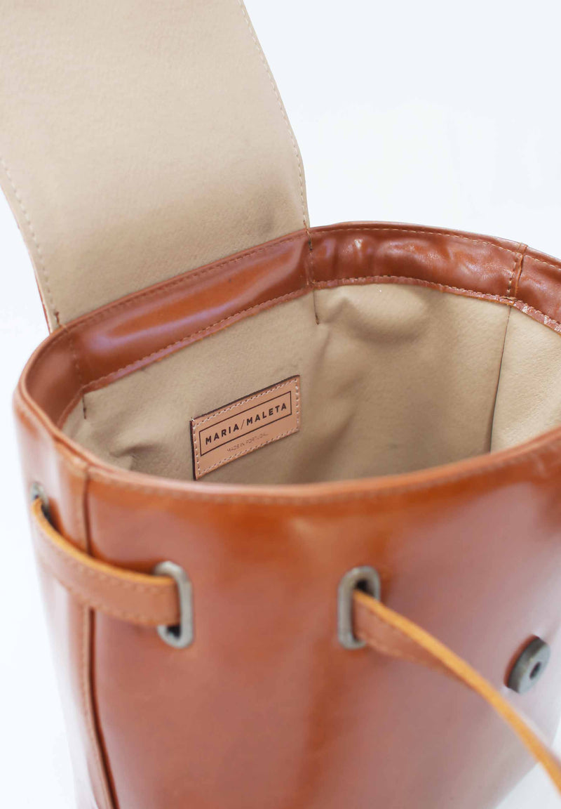 inside view mini bucket bag in brown leather